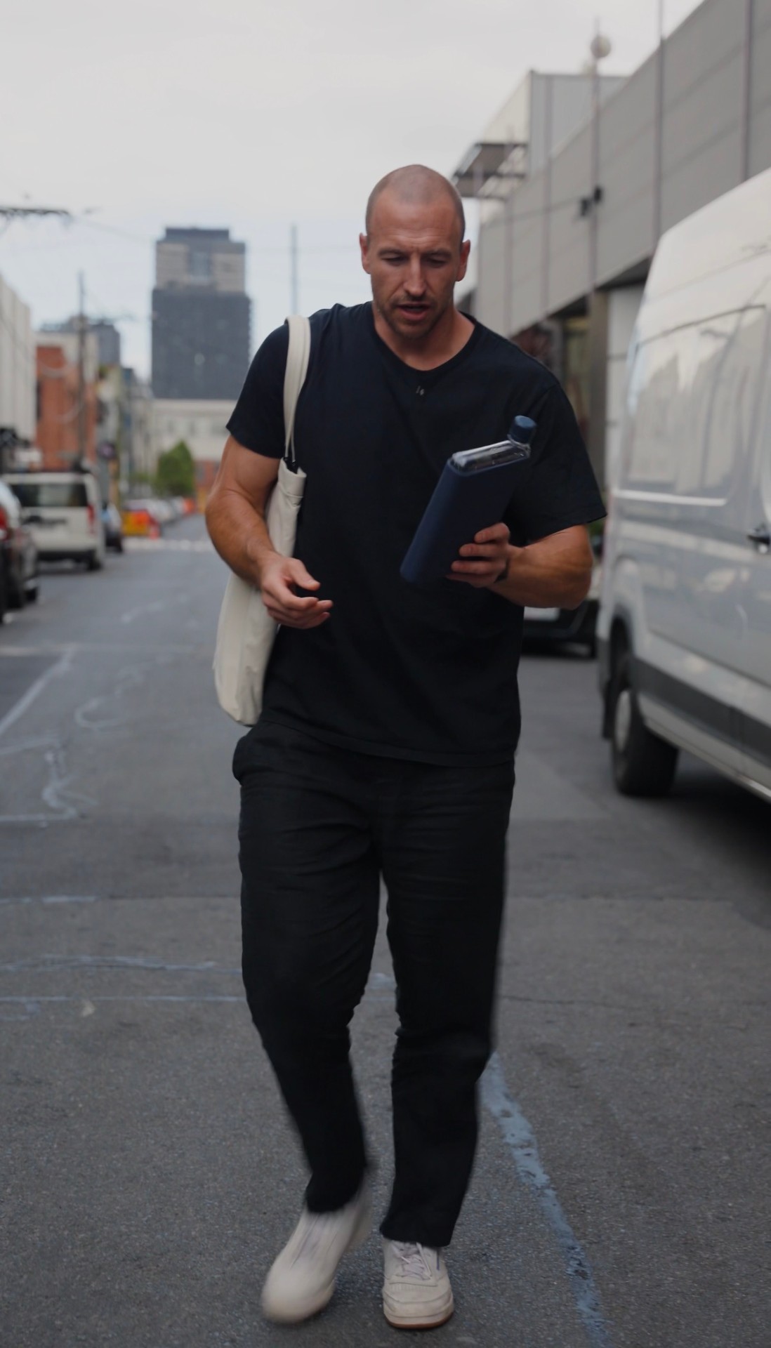 Jonno walking with a memobottle